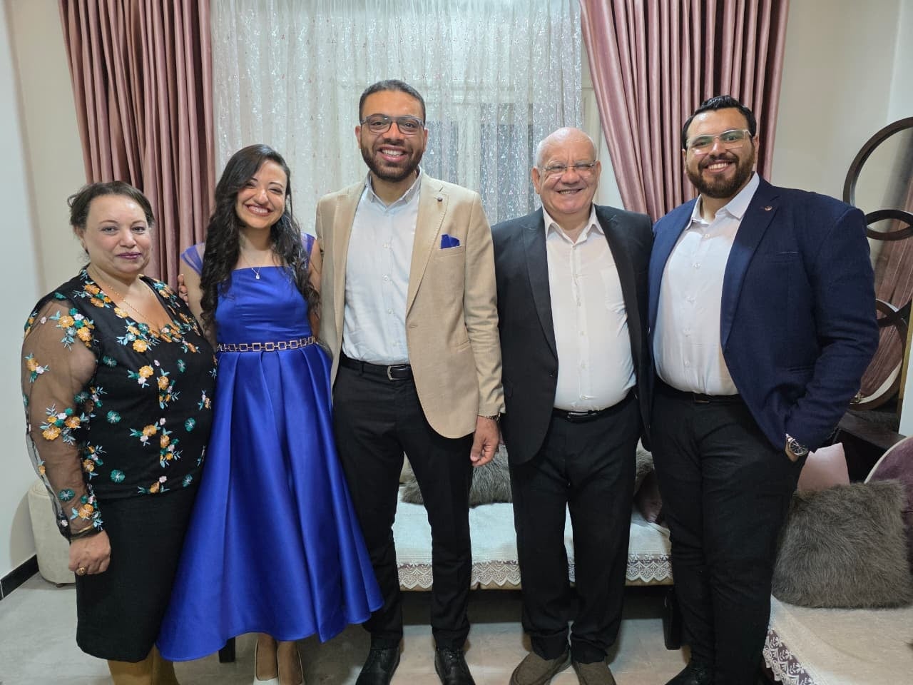 Nada and John with their families on their engagement day