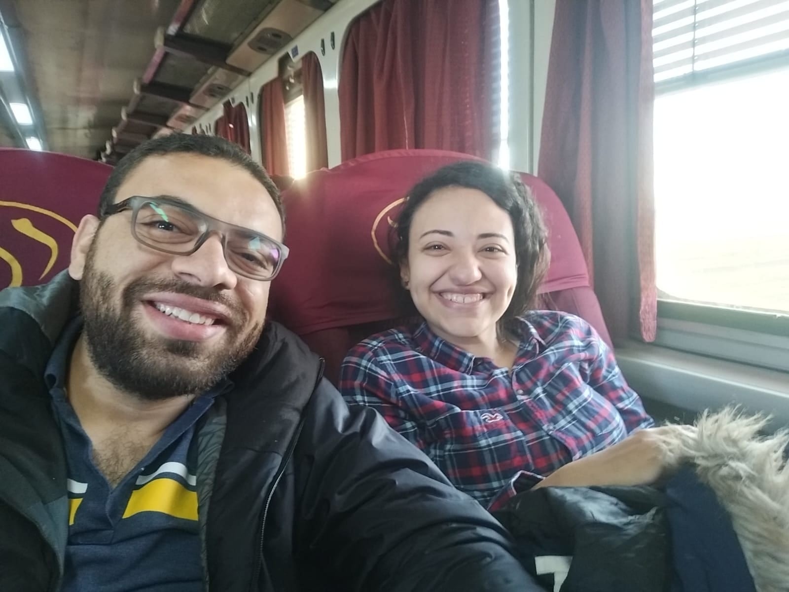 A selfie of John and Nada on a bus trip