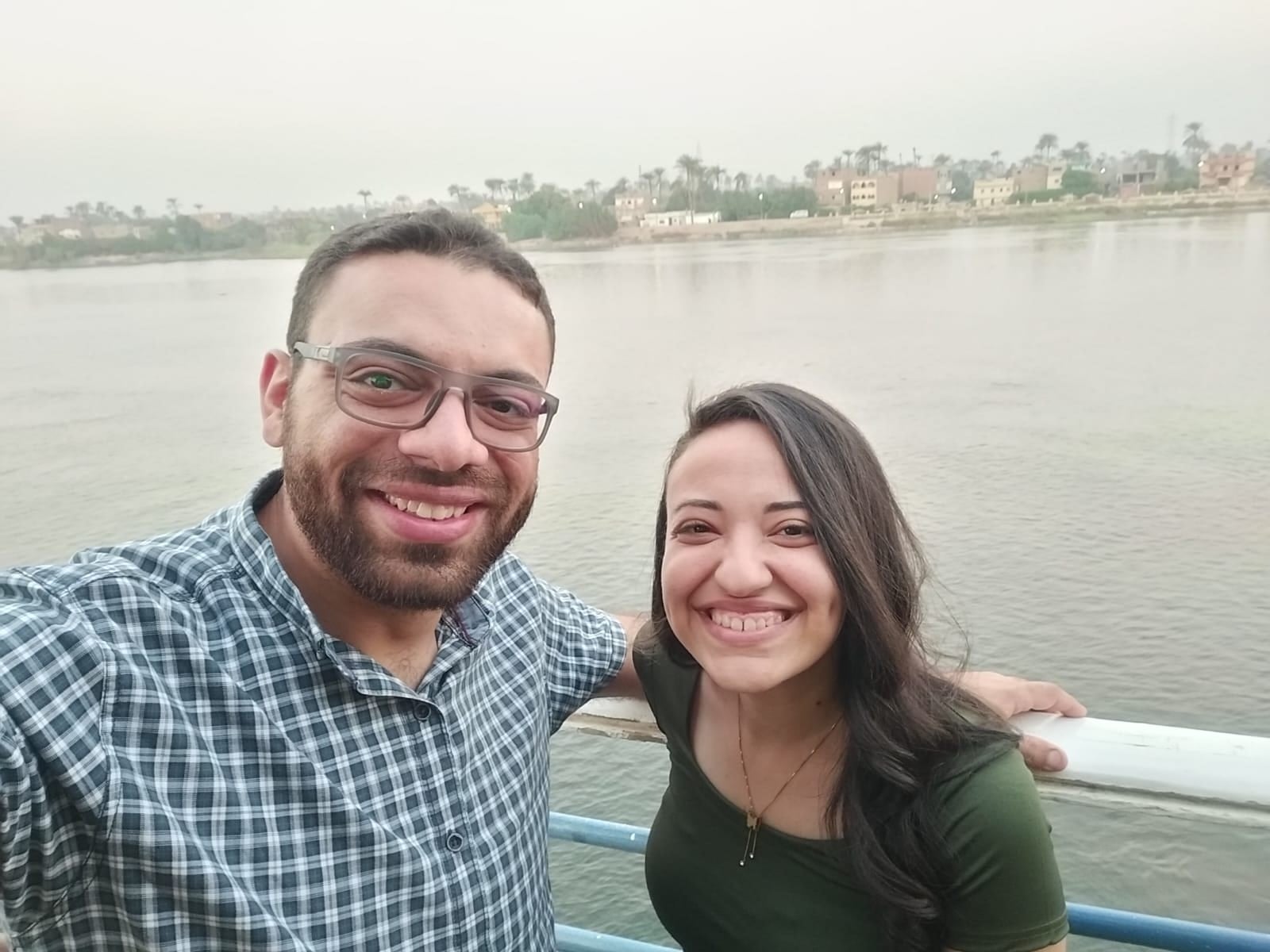 John and Nada smiling on a boat on the Nile